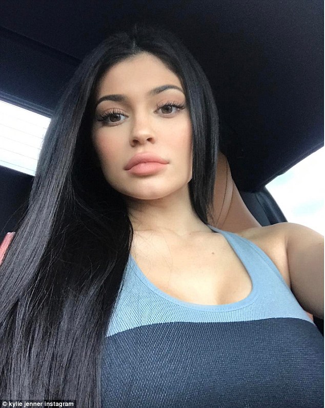 Kylie Jenner highlights her curves in fitness gear while buying luxury handbags