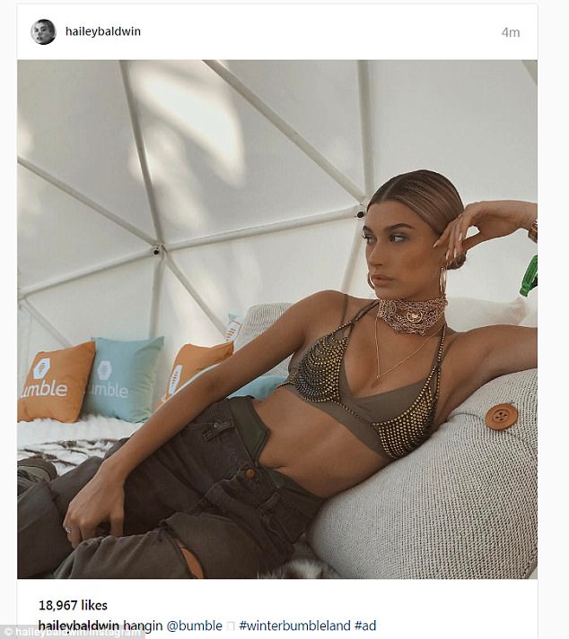 Hailey Baldwin wears green & gold studded bikini at Coachella