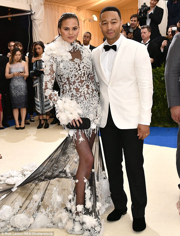 Heaven on earth! Chrissy Teigen flashes the flesh in arty sheer white dress as she attends Met Gala with John Legend