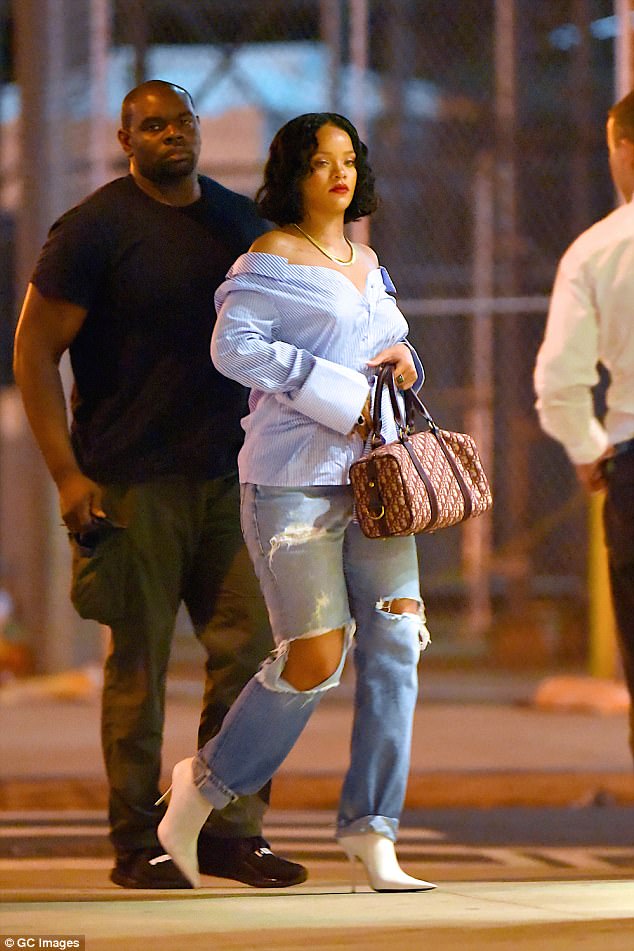 Smart-casual, Rihanna style! Pop star rocks an off-the-shoulder shirt and ripped jeans on night out in Manhattan