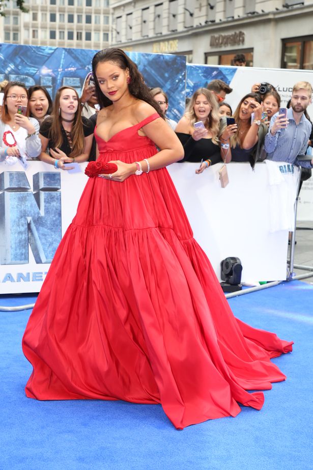 Rihanna puts on VERY booby display in dangerously low Red Dress as she arrives at Valerian premiere