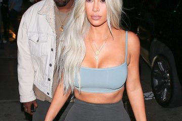 Kim Kardashian flaunts curves in crop top and skintight skirt as she heads to Kendall Jenner’s birthday bash with Kanye West