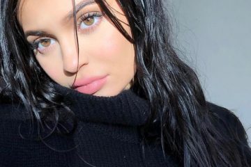 Kylie Jenner posts string of sultry selfies but keeps her ‘baby bump’ covered up under baggy jumper