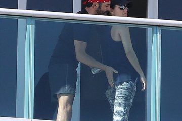 Pregnant Eva Longoria gets a playful pat on her derriere from husband Jose Baston before stepping out for a stroll in Miami