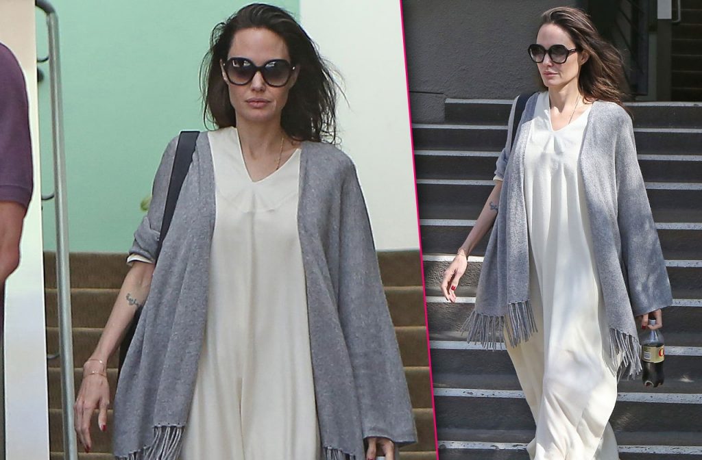 Make up free Angelina Jolie sips on a soda during rare solo outing in Los Angeles