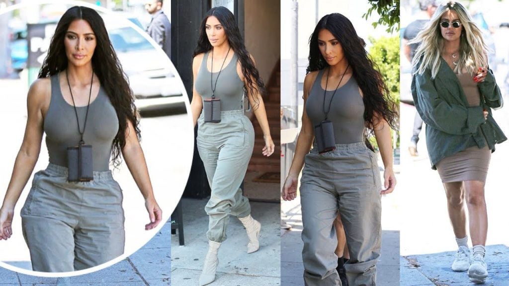 Kim Kardashian gets pulses racing in skintight tank top as she is joined by leggy sister Khloe