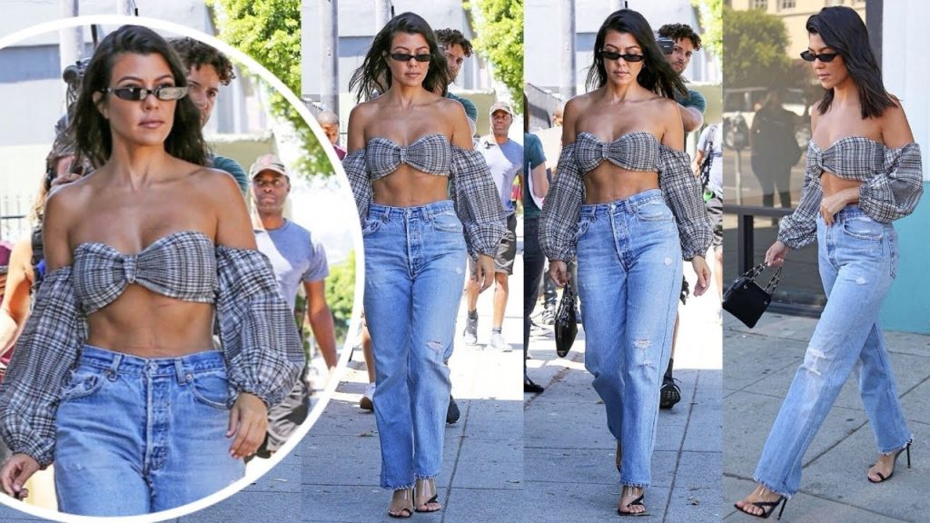 Kourtney Kardashian showcases her ample cleavage and sculpted abs in skimpy Crop Top