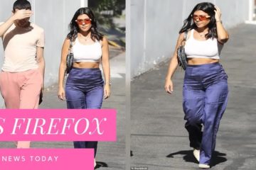 Kourtney Kardashian shows off her sculpted midriff in blue and white after cheering on LA Dodgers