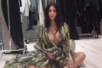 Kim Kardashian poses in the green snakeskin Print Dress