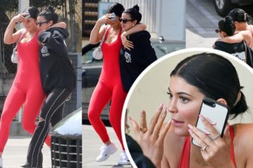 Kylie Jenner in red jumpsuit and swept her dark hair back into a bun step out in LA